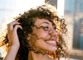 Woman smiling after going to Gramercy Park Dental